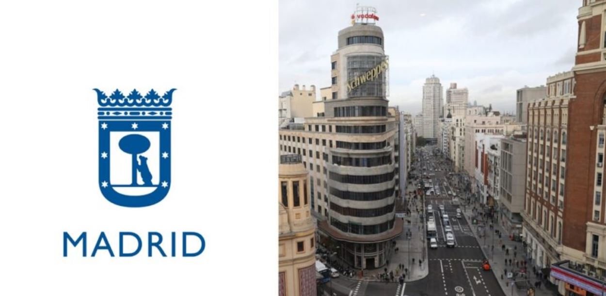 Imagen del logo del ayuntamiento de Madrid y fotografía de la Gran Vía